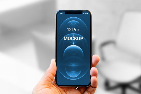 Holding iPhone 12 Pro in Hand - Free Mockup